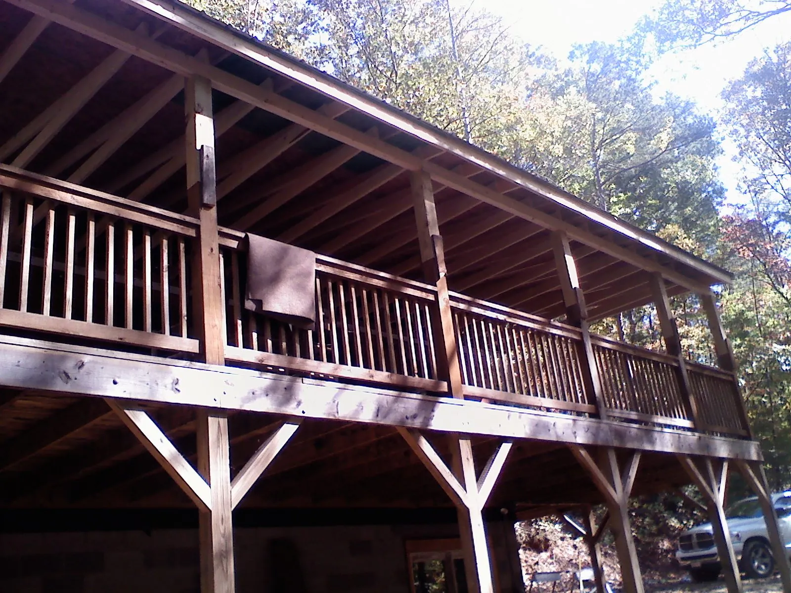 Timber framing under a new elevated porch and deck — Roof Leak Repair in Cedar Creek by Roofing Brothers